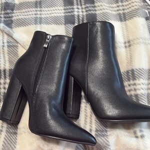High heeled black boots